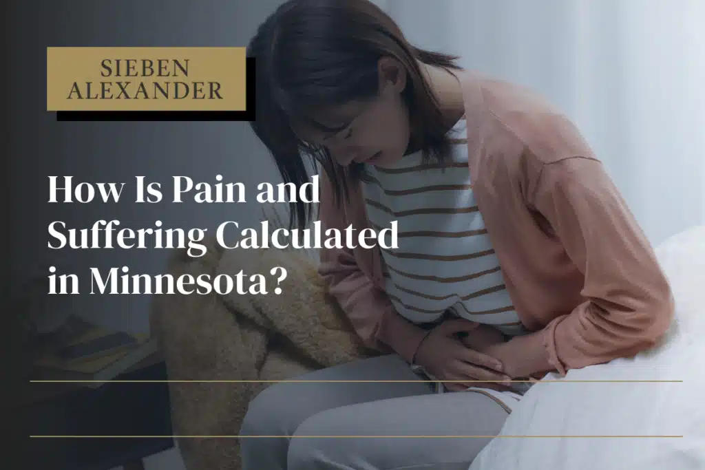 A woman hunched over in pain holding her stomach with the text "How is pain and suffering calculated in Minnesota?"