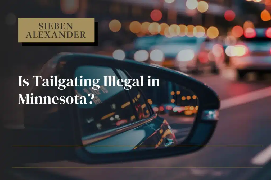 Close up of a drivers side door mirror with the text "Is tailgating illegal in Minnesota?"