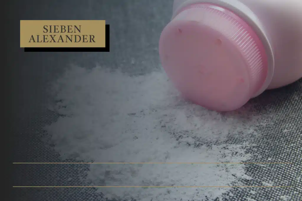 An image of talcum powder spilling out from the bottle on a hard surface