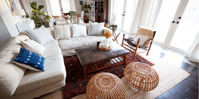 a modern family room with a white couch during daylight