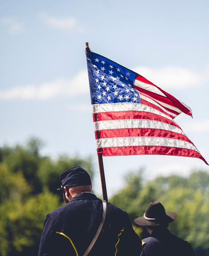 A veteran holding an American flag