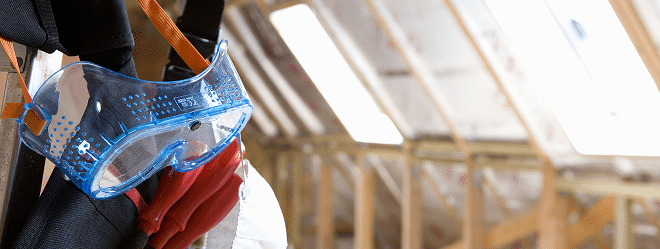 Close up of a hazmat suits tool belt in an empty attic