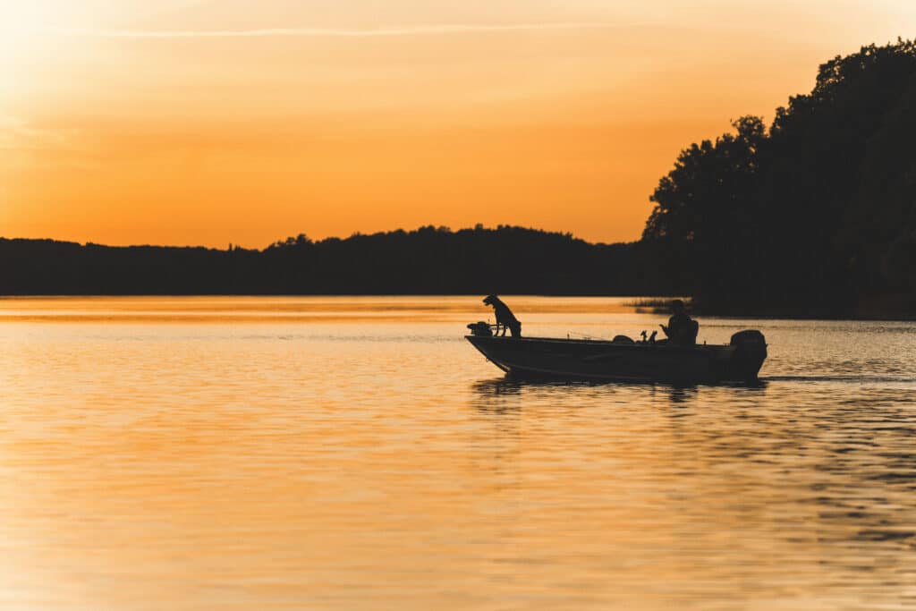 A fishing boat silhouette in the sunset