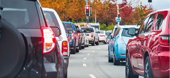 A gridlocked street packed with cars during rush hour