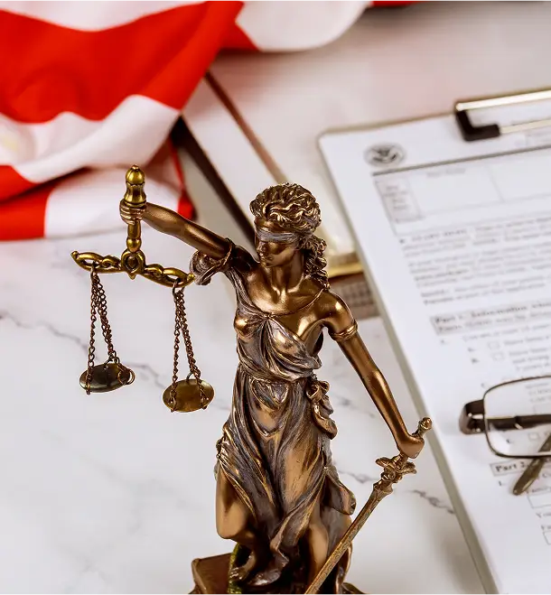 Close up of a bronze Lady Justice statue