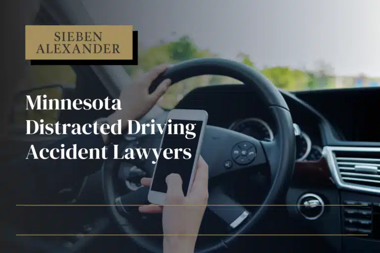 Close up of a hand holding a cell phone and texting while driving with the text "Minnesota Distracted Driving Accident Lawyers"