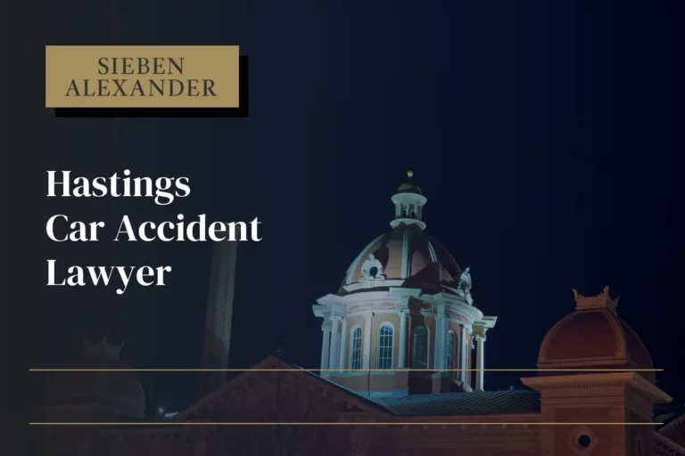Image of a Hastings MN building at night with the text "Hastings Car Accident Lawyer"