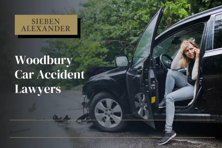 A woman sitting in her damaged car after an accident making a phone call with the text "Woodbury Car Accident Lawyer"